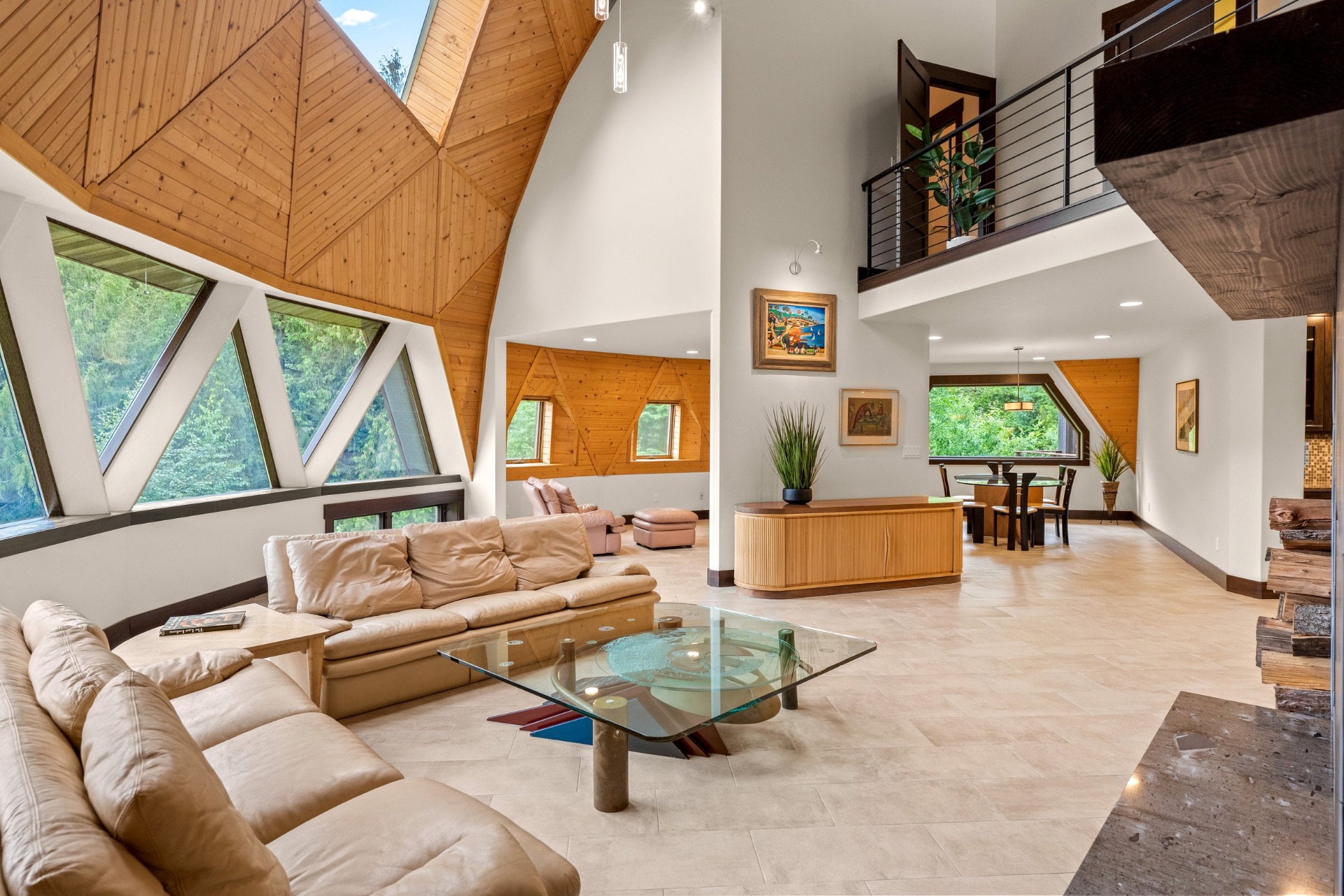 Geometric cedar-ceiling living room inside a dome home
